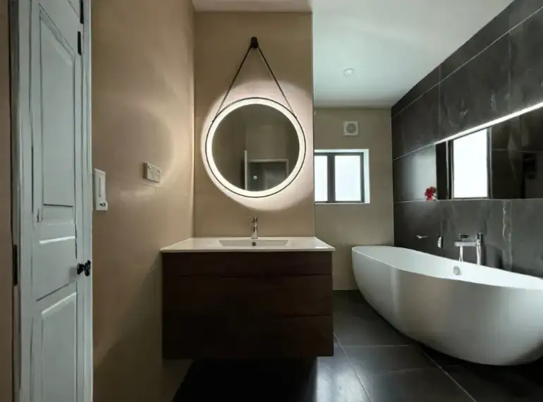 Bathroom renovation with modern tiles and grout finishing